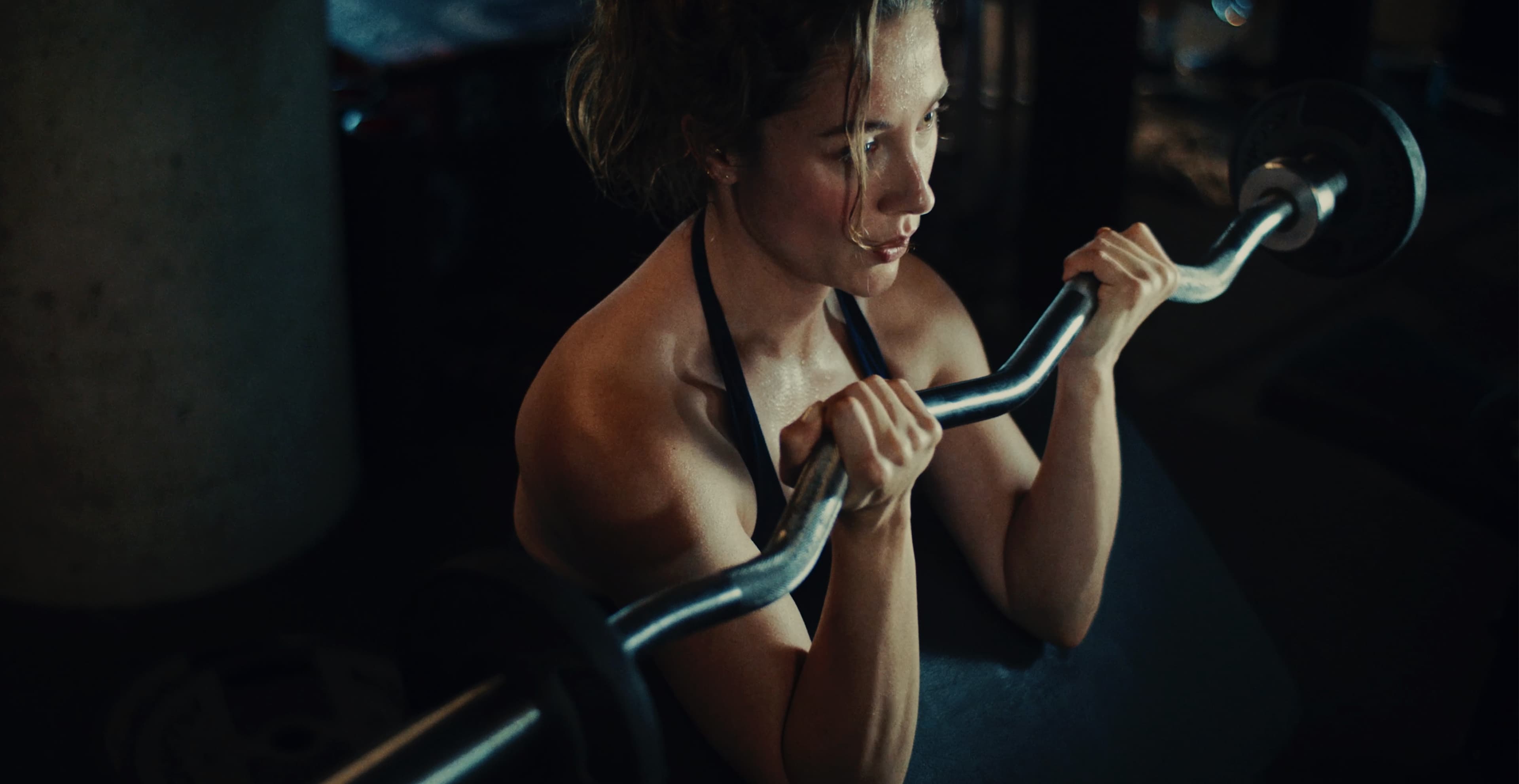 woman lifting barbell